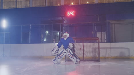 Hockey-player-carries-out-an-attack-on-the-opponent's-goal-and-scores-a-goal-in-extra-time.-The-player-brings-victory-to-his-team-in-shootouts